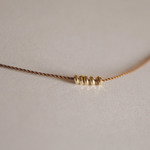 k18 brown nylon ball necklace