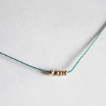 k18 green nylon ball necklace