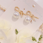 ゴールドリボン×一粒パールのピアス／イヤリング　　大ぶり　大人可愛い　結婚式　フォーマル　