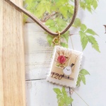 シマエナガの切手ネックレス(赤の花)