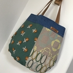 ミナペルホネン⭐︎パッチワーク⭐︎本革ハンドルのまあるいペタンコバッグ 