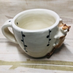 しがみ付き茶白ねっこのマグカップ