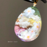 枝垂れ桜舞い散る夕焼け空。　オルゴナイト　雲レジン　たまご型　ネックレス