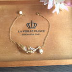 【羽モチーフ】ゴールドフェザーとコットンパールのブレスレット