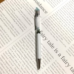 ボールペンに小さな鉱石を