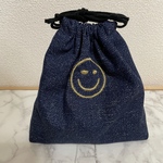 ワンポイント刺繍のコップ袋【ニコちゃん】