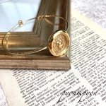 vintage button𓆸⋆*アンティークゴールドライオンの華奢ブレスレット
