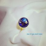 「小宇宙の中の地球とギア」リング