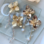 shellandsea   ゴールドフラワー×キラキラストーン×タッセルピアス