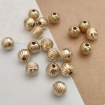 096kc[50個] 7mm アンティーク風 メタルビーズ すじ入りラウンド アクリルビーズ