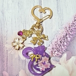 くるりんしっぽのねこちゃんのキーホルダー・ハンドメイド・レジン・チャーム・桜の花・猫・和