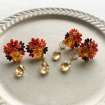 こっくりオレンジのお花とアンバーのイヤーアクセサリー