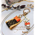 モノグラムタッセルとオレンジバッグのチャーム🧡
