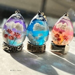 夜に咲く白彼岸花の蓄光雲レジンネックレスたまご型　蓄光三日月※こちらはお写真真ん中の白彼岸花versionのみになります☆