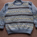 水色の編み込みセーター