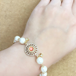 エスニックパーツとパールのブレスレット