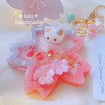 【New】猫ちゃんの桜咲くシャカシャカキーホルダー　ハンドメイドレジン　キーホルダー　ハンドメイドキーホルダー　春　猫　シャカシャカキーホルダー　シャカシャカ　シェイカー　桜　ゆめかわ　