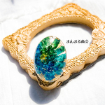 【喜びの花💍】マトリカリア／ドライフラワー／グリーン／ブルー／グラデーション／金箔／オーバル／大ぶり／スチール／フリーサイズリング