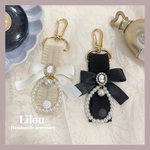 【𝖭𝖾𝗐】𝐫𝐢𝐛𝐛𝐨𝐧 𝐜𝐚𝐦𝐞𝐨 𝐛𝐚𝐠 𝐜𝐡𝐚𝐫𝐦 ♥カメオビジューカチューシャホルダー/ブラック テーマパーク 遊園地