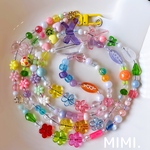 スマホストラップ🎀ビーズストラップ🌼ショルダーストラップ💚スマホショルダー🟠ネックストラップ🧸ロングストラップ🌼スマホ用タグ付 ☺︎りぼんとお花☺︎ 💛/ MIMI.