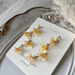 ゆらゆら揺れる💛金木犀の耳飾り ✳︎ ピアス・イヤリング・ノンホールピアス　秋色　お花の耳飾り アメリカンフラワー ディップフラワー  アクセサリー オレンジ色  蓄光パウダー入