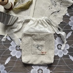 ミナペルホネンchouchoの巾着ポーチ. b