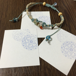 white cards with purple lace