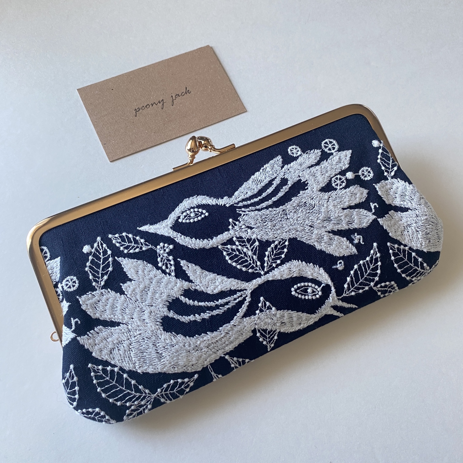 新作✨【横長仕切りがま口】carnival × smile flowerネイビー ミナ