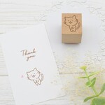笑顔でぺこりとおじぎをする猫のはんこ