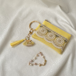 インド刺繍リボンのフェイクレザーミニポーチ　丸カラビナ、タッセルチャーム付