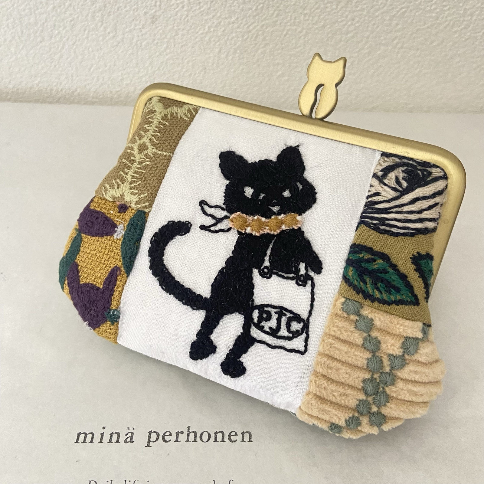 ミナペルホネン がま口ポシェット celebrate ハンドメイド（ミナ