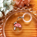 ピンクの傘とテルテル坊主