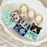 藍色とミントブルーのお花のインド刺繍リボンと猫さん刺繍のキーリング
