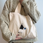 シカクイトート　ブラウンコートのお姉さん