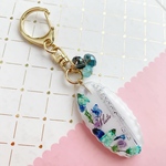 【2719】フルート 水色ヒメウツギと青いお花と紫ビーズ入りキーホルダー