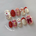 hokkori cake 🧁🧶🧡【レッドチェック×リボンネイルチップ／クリスマス／ハート／ぷっくりアート／冬ネイル／大人かわいい／ガーリー／デートネイル】