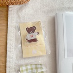 セーターを着たこげ茶くまさんクリップ