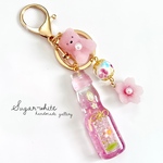 🫧soda bottle ✵ 桜のラムネ瓶シェイカーとお砂糖クマさん     バッグチャーム   キーホルダー   レジン  とんぼ玉