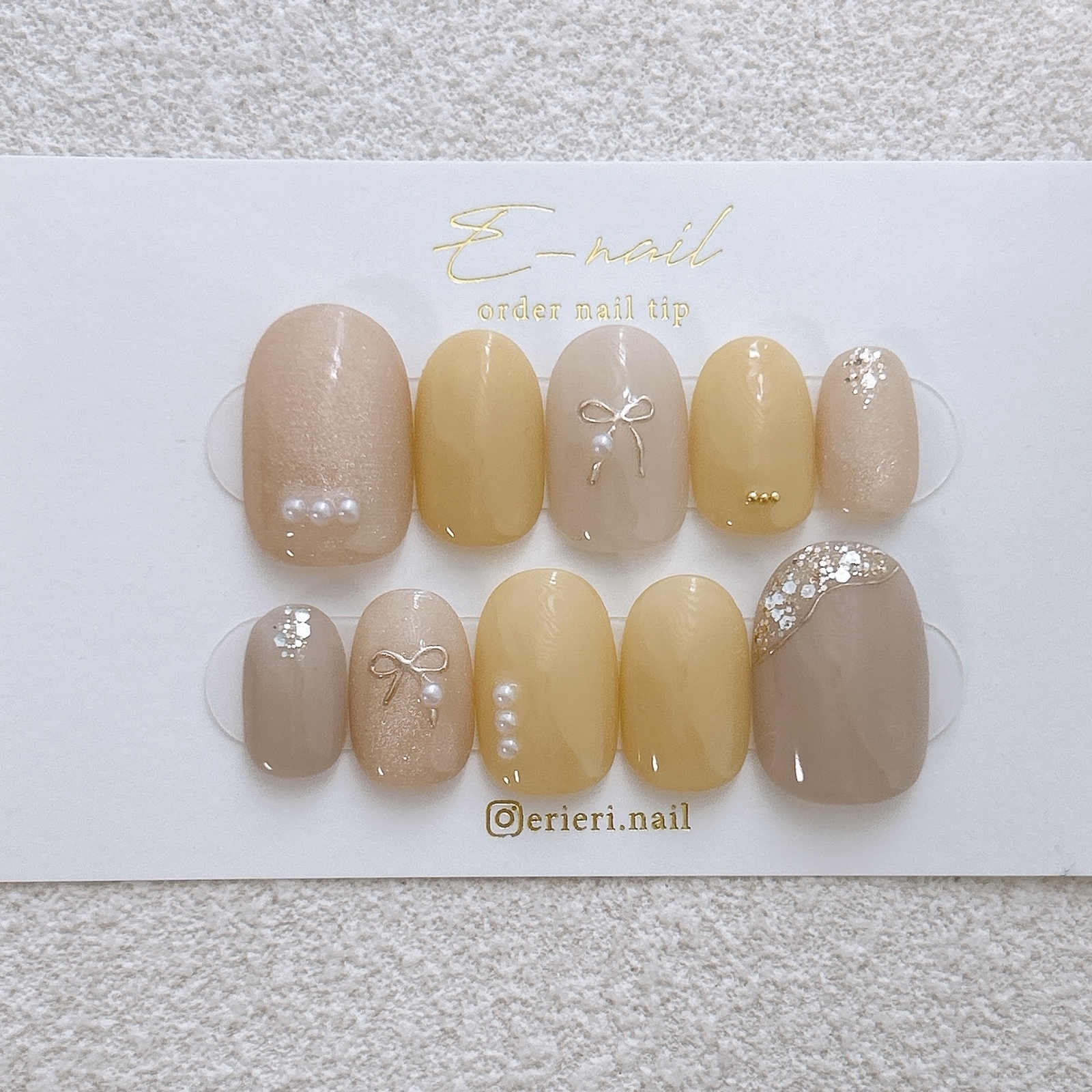バターイエロー × リボン 黄色 マグネット 大人ネイル 上品 春ネイル 