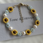 【26春New!】ひまわりとネモフィラ | 淡水パールとお花のビーズブレスレット | おとな きれい目コーデ | おとなのビーズアクセサリー | パールアクセサリー 