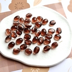 【新作】つやつやガラスのコーヒー豆ビーズ（11×8.5mm）ブラウン