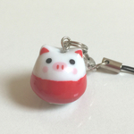 陶器のブタだるまのストラップ