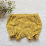 グラフチェックの黄色いかぼちゃパンツ