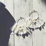 White tassel cross pierce