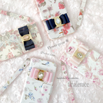 ジュエルリボン×フラワープリント 手帳型 iPhoneケース