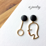 women's profile earrings