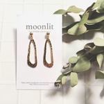 gold hoop pierce