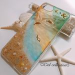 【sky_0814様専用】砂浜に虹色水面模様のiphone 8ケース🐚