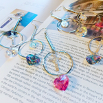 スワロのハートとメダイクロスピアス