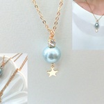 ミントブルーの惑星ネックレス　スワロフスキー　コットンパール